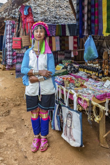 Tribal woman selling woven scarves and other crafts in the Long Neck Karen tribe (more properly called the Kayah Lahwi tribe) area of the Union of Hill Tribe Villages outside of Chiang Rai in the Nanglae District of Thailand