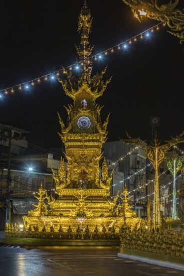 Clock Tower of Chiang Rai monument designed by local artist Chalermchai Kositpipat to honor the late Thai king