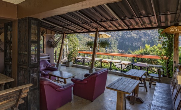 Stairs lead down to the Doi Phamee coffee shop and restaurant in Mae Sai district of Chiang Rai, Thailand