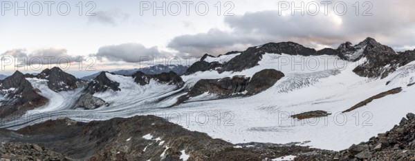 Sunset at the summit of the Becher, picturesque high mountain landscape, view of mountain peaks Königshofspitz and Sonklarspitze and Schwarzwandspitz with glacier of the Übeltalferner, Stubai Alps, South Tyrol, Italy