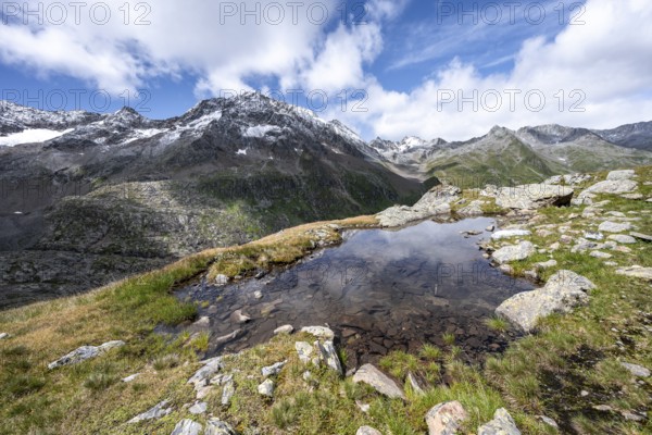 Small mountain lake, Roter Knopf mountain peak, Vienna High Trail, Schober Group, Hohe Tauern National Park, Carinthia, Austria