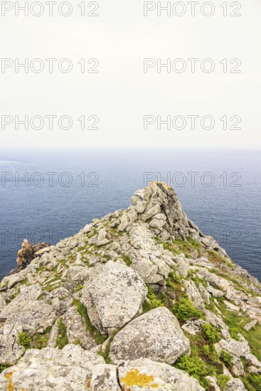 Rocky peninsula with a sea view to the horizon on a desolate sea in the summer, Crozon peninsula, Bretagne, France