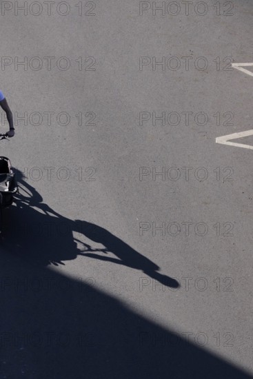 Shadow of a cyclist, Summer, Germany