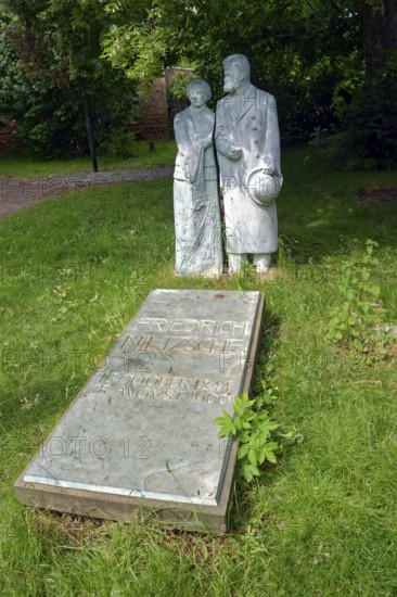 The philosopher Friedrich Nietzsche on his mother's arm at his grave, sculptures Röckener Bacchanal by Klaus F. Messerschmidt, Röcken, town of Lützen, Saxony-Anhalt, Germany