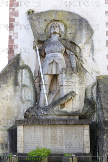 St George the Dragon Slayer with dragon on the exterior façade of St Martin's Church in Endingen am Kaiserstuhl, Baden-Württemberg, Germany