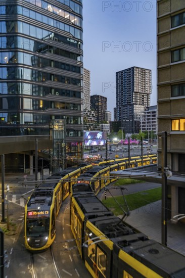 Utrecht city centre, high-rise office and residential buildings on Jaarbeursplein, at Utrecht Centraal railway station, trams, public transport stop, Netherlands