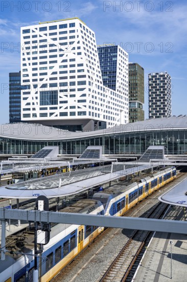 Utrecht Centraal railway station, tracks and concourse, trains of Nederlandse Spoorwegen N.V. state railway company, office building in the city centre, Netherlands