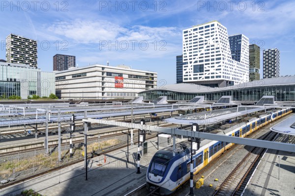 Utrecht Centraal railway station, tracks and concourse, trains of Nederlandse Spoorwegen N.V. state railway company, office building in the city centre, Netherlands