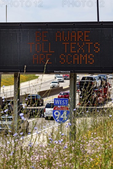Detroit, Michigan - A message on an electronic road sign on Interstate 94 warns drivers about common scams that demand payment for using toll roads
