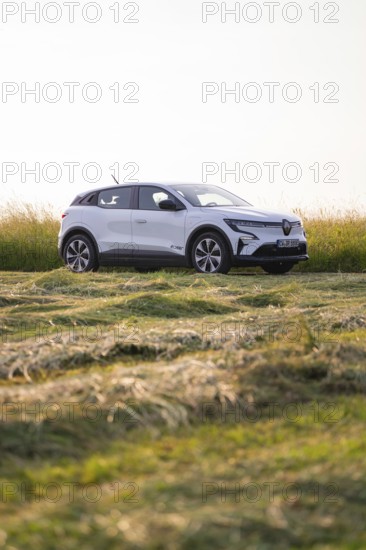 Parked car in a green field landscape, Renault Megane, Deer E Carsharing, electric car, Calw, Black Forest, Germany