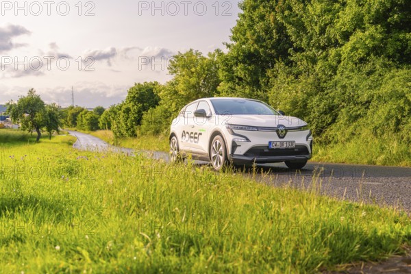 Renault car on a road, surrounded by green trees and meadows, Renault Megane, Deer E Carsharing, electric car, Calw, Black Forest, Germany