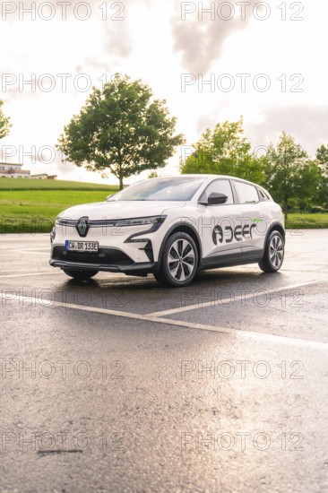 Renault electric car parked in a wet car park under a dramatic evening sky, Renault Megane, Deer E Carsharing, electric car, Calw, Black Forest, Germany