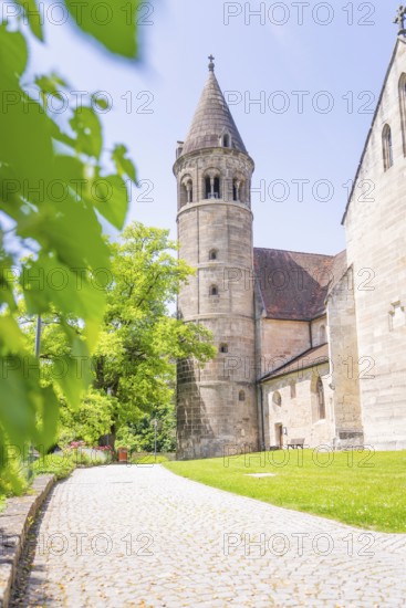 Medieval church tower next to a tree-lined green path on a summer's day, event and wedding location Lorch Monastery, Lorch, Germany