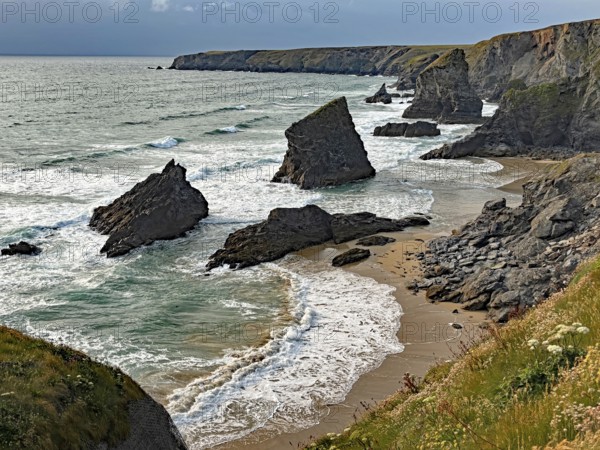 Dramatic coastal landscape with rocks and waves on the beach, Bedruthan Steps, Newquay, Cornwall, England, Great Britain