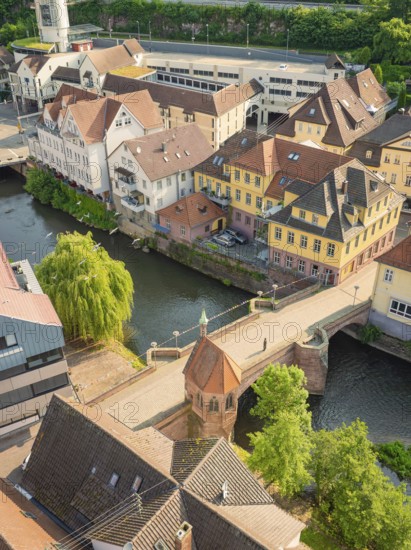 Picturesque town view with river and half-timbered houses next to a stone bridge, Calw, Black Forest, Germany