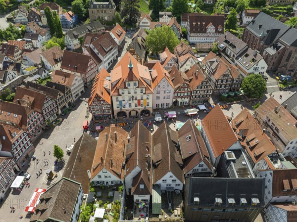 Aerial view of an old town with half-timbered houses and a busy square in an urban environment, Calw, Black Forest, Germany