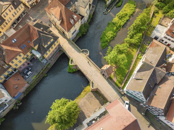 Aerial view of a bridge over a river with colourful roofs, Calw, Black Forest, Germany