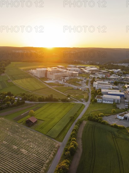 Paisage at sunset with fields and industry, surrounded by hills, Calw, Black Forest, Germany