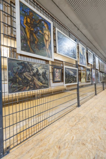 Gallery wall with various paintings in a modern art gallery ambience, historical art exhibition in the old swimming pool, show depot, Calw, Black Forest, Germany
