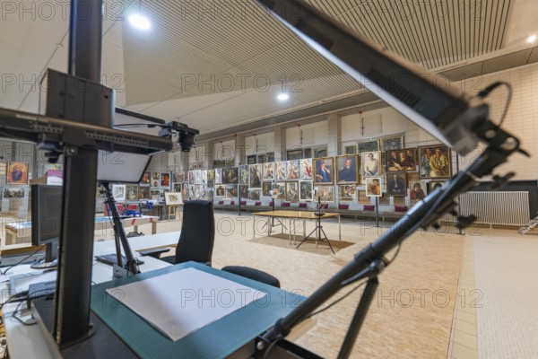 Working area in a gallery with view of exhibited works of art, historical art exhibition in the old swimming pool, show depot, Calw, Black Forest, Germany