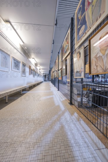Long corridor in a gallery, lined with works of art on the walls, historical art exhibition in the old swimming pool, show depot, Calw, Black Forest, Germany