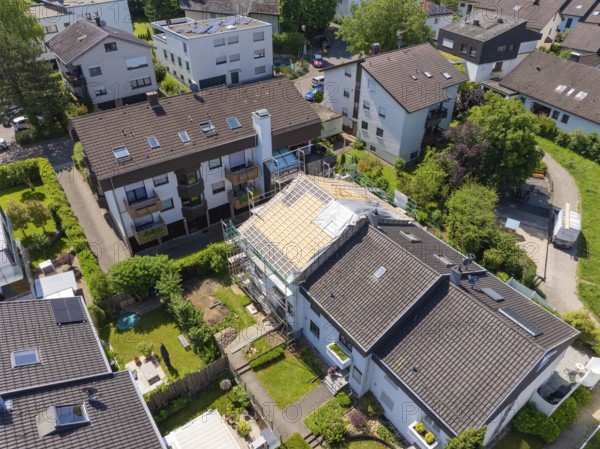 Aerial view of a residential area with a house showing roof work in the middle of green areas, roof renovation, house construction, Pforzheim, Germany