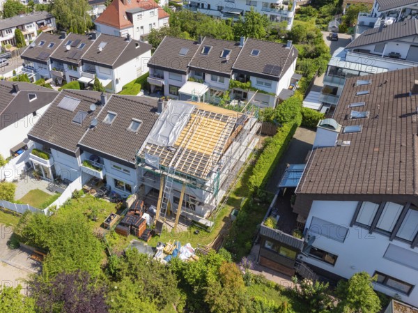 View over a residential area. A roof under renovation, surrounded by other houses, roof renovation, house construction, Pforzheim, Germany