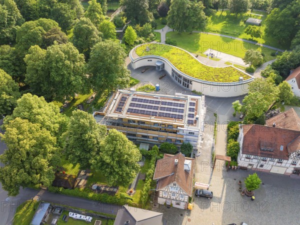 Modern building site with solar modules and green roof in a rural setting, Hirsau, Calw, Germany
