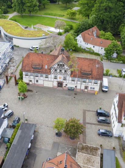 Central view of half-timbered structure with cobblestones and green surroundings, Hirsau, Calw, Germany