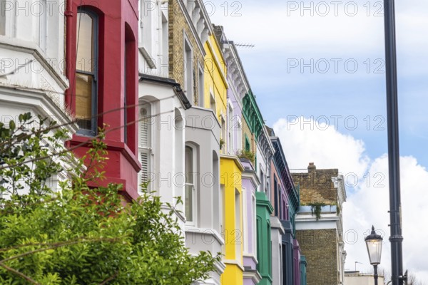 Traditional terraced houses showcasing a vibrant array of colors in the charming neighborhood of notting hill, london, creating a picturesque urban landscape