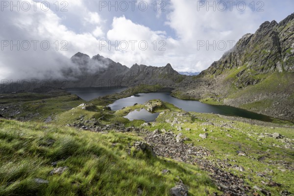 Mountain landscape with mountain lakes Wangenitzsee and Kreuzsee, cloudy mountain peaks in the morning light, Schober Group, Hohe Tauern National Park, Carinthia, Austria