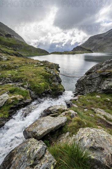Suspension bridge over a mountain stream at the Wangenitzsee mountain lake, Schober Group, Hohe Tauern National Park, Carinthia, Austria