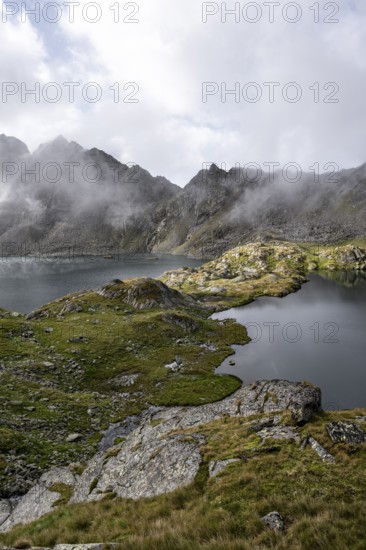 Mountain lakes Wangenitzsee and Kreuzsee, cloudy mountain peaks in the morning, Schober group, Hohe Tauern National Park, Carinthia, Austria
