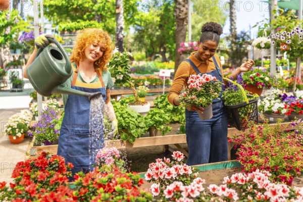 Two young women working together in a vibrant garden center, watering and arranging colorful potted flowers with care and teamwork