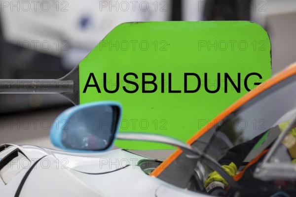 (Photomontage) Training Symbol image: Lollipop in motorsport with modified text TRAINING