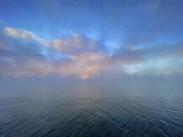 Fog and clouds over Lake Starnberg, Bavaria, Germany