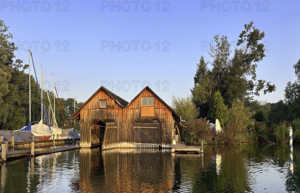 Boathouses on Lake Starnberg in the evening, Bavaria, Germany