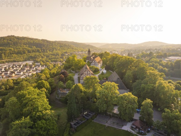 Aerial view of a village with half-timbered houses and church in hilly surroundings, event and wedding location Lorch Monastery, Lorch, Germany
