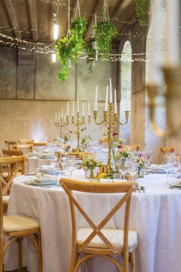 Festively decorated wedding tables with candle holders and floral decorations, event and wedding location Lorch Monastery, Lorch, Germany