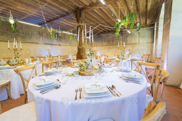 Elegant wedding decor in a rustic room with fairy lights and green accents, event and wedding location Kloster Lorch, Lorch, Germany