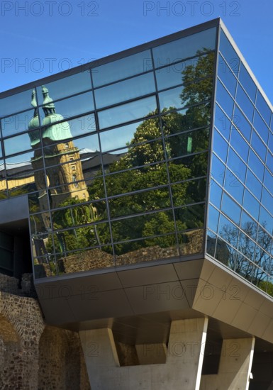 West side of the Congress Centre Darmstadtium with reflection of the Hessian State Museum in the centre of Darmstadt, Hesse, Germany