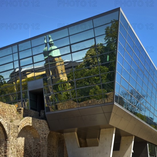 West side of the Congress Centre Darmstadtium with reflection of the Hessian State Museum in the centre of Darmstadt, Hesse, Germany