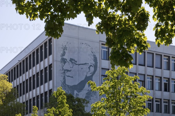 Vocational school centre Mitte Peter-Behrens-Schule with the portrait of Peter Behrens on the exterior facade, Darmstadt, Hesse, Germany