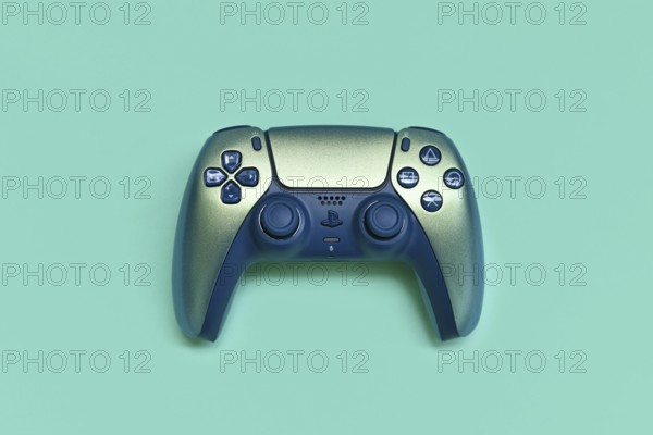 Germany - May 2025: Sony DualSense Wireless Playstation 5 Controller in Chroma Teal color on turquoise background