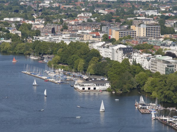 DefaultAerial view of the Outer Alster with sailing ships and view of the rowing club Allemania from 1866 surrounded by green trees and urban buildings, Hamburg, Germany