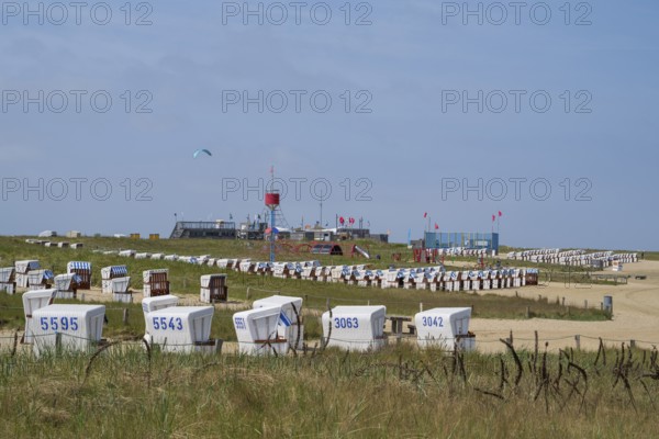 Beach chairs on the family lagoon, Perlebucht, Büsum, North Sea, Schleswig-Holstein, Germany