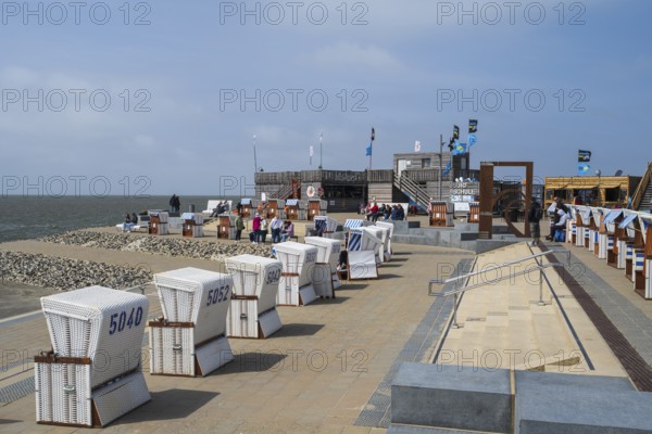 Beach chairs on the promenade, family lagoon, Perlebucht, Büsum, North Sea, Schleswig-Holstein, Germany