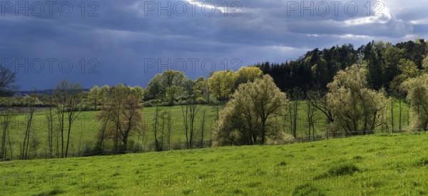 Rain clouds in a spring landscape, Franconia, Bavaria, Germany