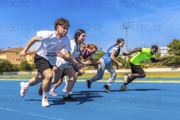Diverse group of athletes sprinting on a vibrant blue running track under a bright sun, showcasing energy and determination in competition