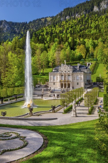 Water parterre with large fountain and portal of Linderhof Castle in spring, municipality of Ettal, Ammergau Alps, Ammertal, Upper Bavaria, Bavaria, Germany